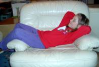 Krista laying on a sofa